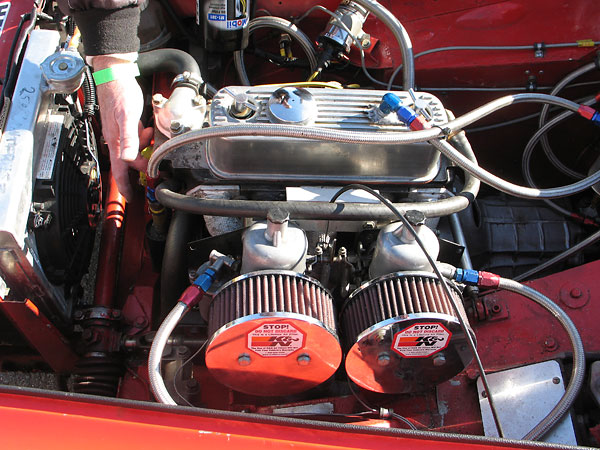 Dual 1.5 inch S.U. carburetors,	mounted on a Maniflow tubular steel manifold. K&N air filters.