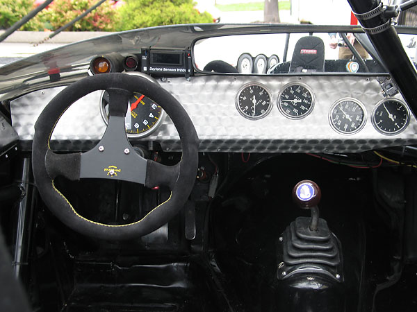 Personal suede covered ergonomic steering wheel, mounted on a quick release hub.