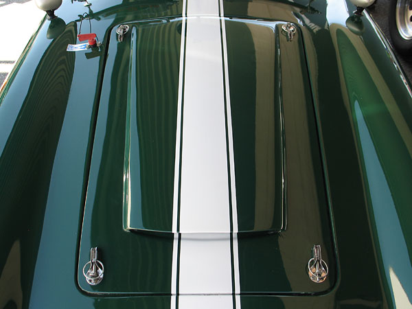 The bonnet is mounted on four OMP aluminum hood pins.