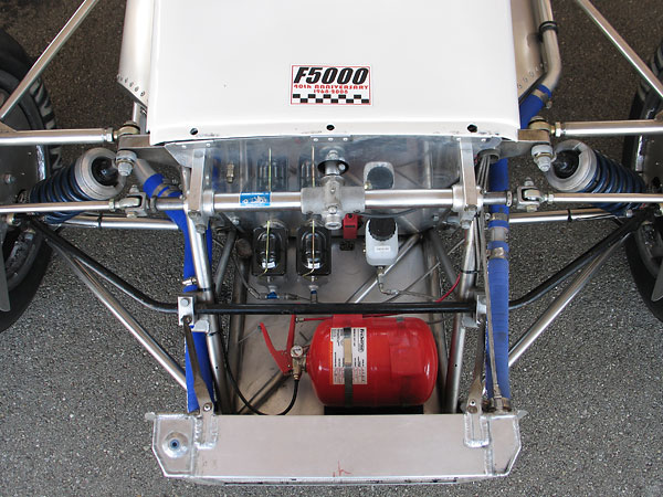 Dual Wilwood high-volume aluminum master cylinders, with bias bar, running Motul brake fluid.