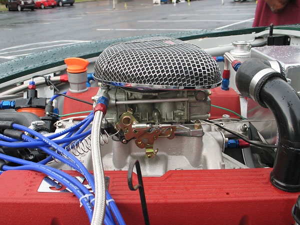 Holley four barrel carburetor atop an Edelbrock Performer 3.5L intake manifold.