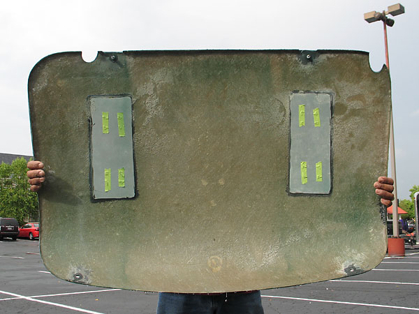 The boot lid is attached to the car with four quarter-turn fasteners.