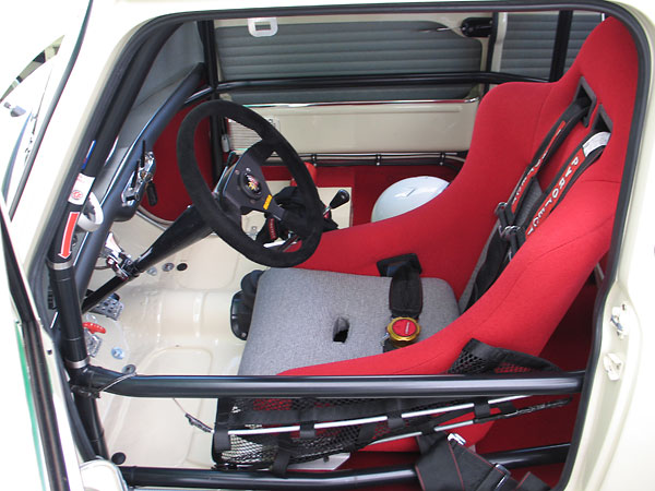 Cobra racing seat (recovered to match other interior trim.)