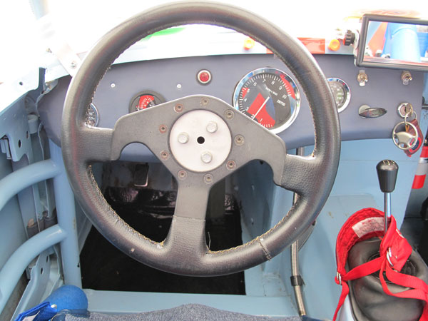 Leather wrapped performance steering wheel of unknown vintage and manufacture.