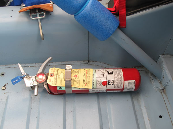 Hand-held fire extinguisher.