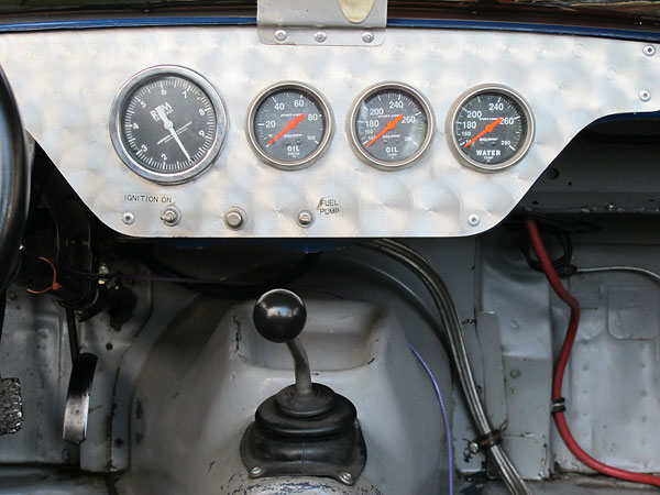 Jones mechanical tachometer. AutoMeter oil pressure, oil temp, and water temp gauges.