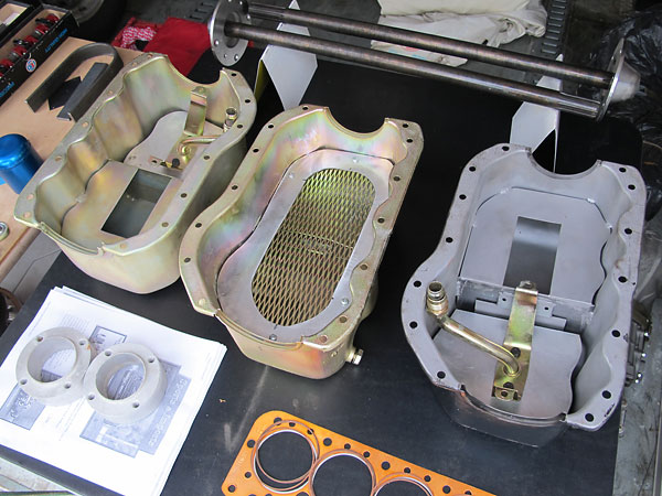 Two styles of Sports & Imports wet sump oil pans.