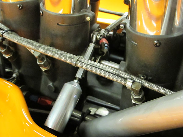 Throttle linkage, attached to MacKay fuel injection throttle bodies.