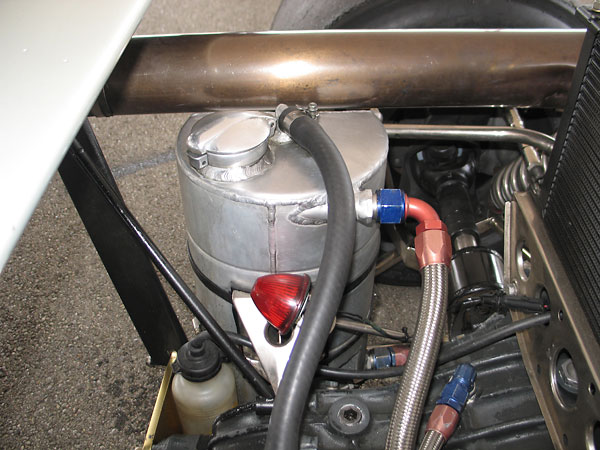 This engine oil reservoir has been specially modified to provide clearance to the exhaust pipe.