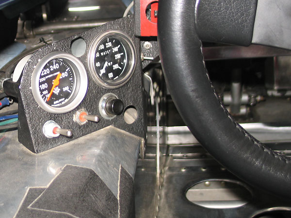 AutoMeter Sport-Comp oil temp (140-280F) and Stewart Warner water temp (100-265F) gauges.