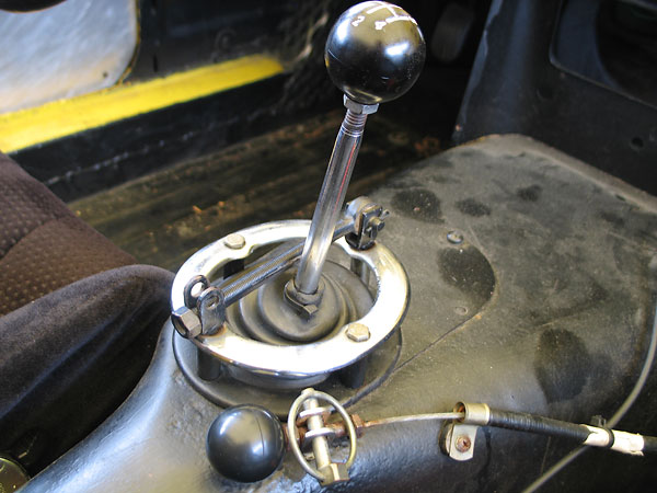 Center: this device blocks the reverse shift gate while racing. Foreground: actuator for the fire extinguisher.