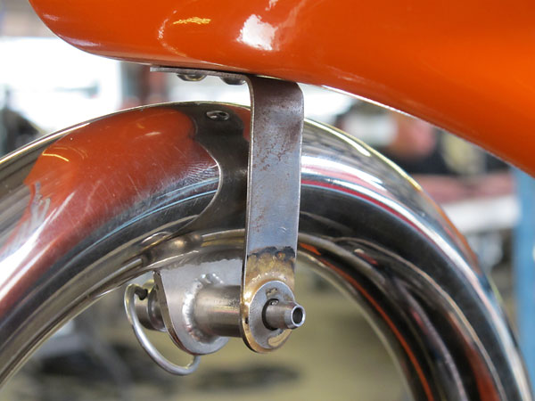The airbox is held on by one pip pin at the front plus four spring-loaded clamps.