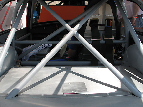 The X-shaped rollcage brace can be unbolted to facilitate removal of the fuel cell.