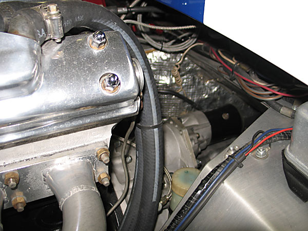 The starter motor is mounted from the rear because the flywheel and ring gear are small in diameter.