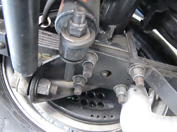 At one end the Panhard rod is attached to the axle.