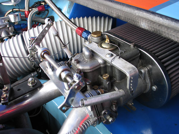 Weber 45DCOE carburetor on a fabricated manifold. K&N oiled gauze filter.