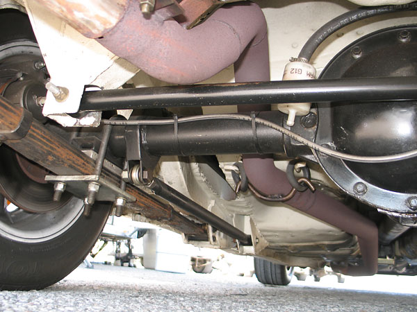 Long, level Panhard rod and its attachment to the body (at left).