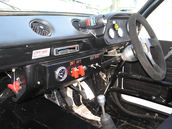 Switches (left to right): battery disconnect, fuel pump, ignition, starter (pushbutton), lights, wipers.
