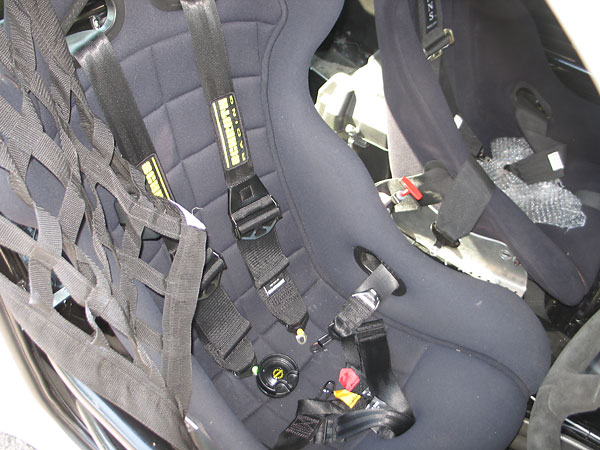 Schroth Racing 6-point cam-lock safety harness.