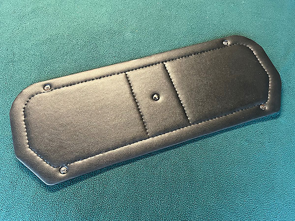 Upholstered aluminum cargo compartment cover.
